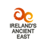 Family enjoying a scenic view at a charming Irish resort, with "Ireland's Ancient East" logo.