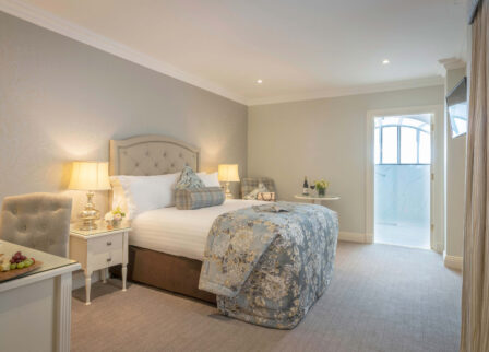 Cosy hotel room with stylish decor, inviting bed, and a welcoming atmosphere.